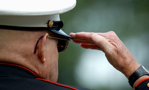 Senior veteran saluting